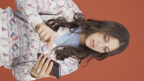 Vertical-video-of-The-young-woman-who-can't-use-the-app-on-the-phone.